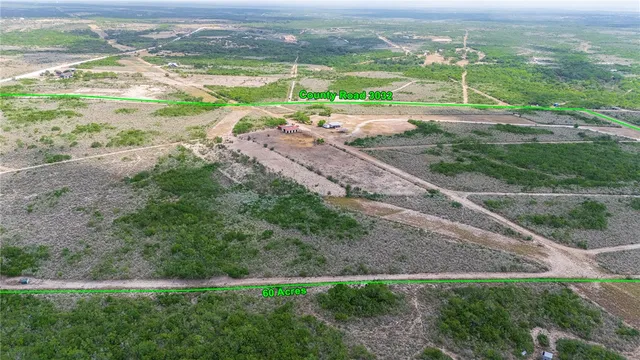 a view of a field with an ocean view
