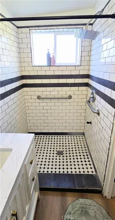 a bathroom with a bathtub and shower