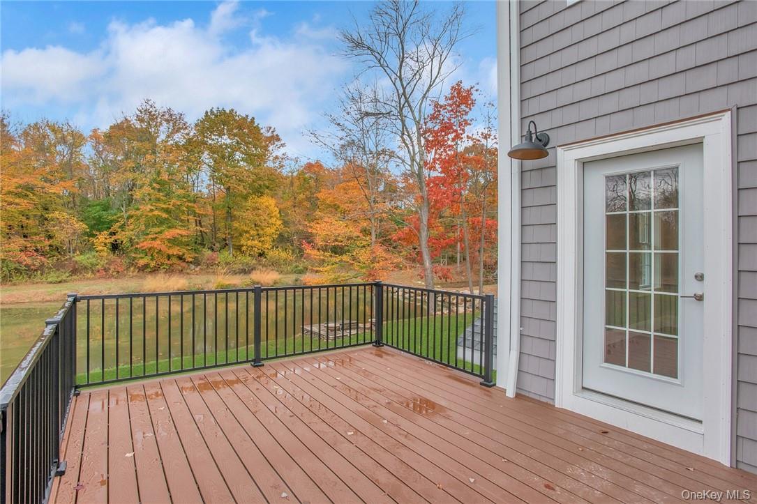 237 Tomahawk Street, Unit 3 Baldwin Place, NY 10505 - Photo 17 of 22 a view of balcony with wooden floor and fence