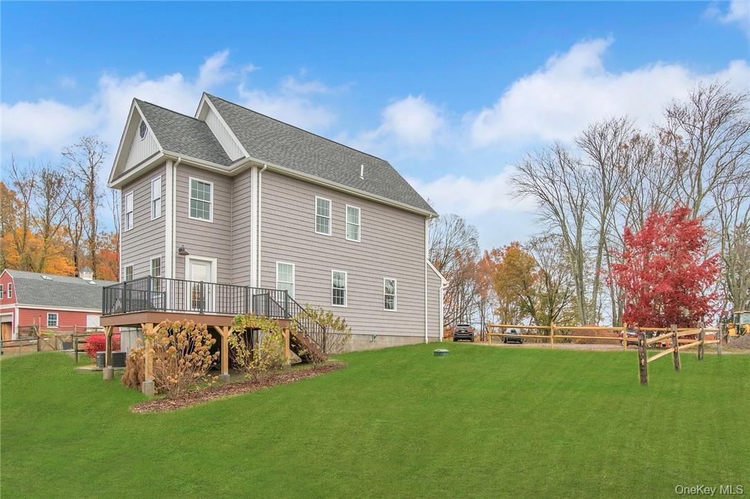 237 Tomahawk Street, Unit 3 Baldwin Place, NY 10505 - Photo 18 of 22 a front view of a house with garden