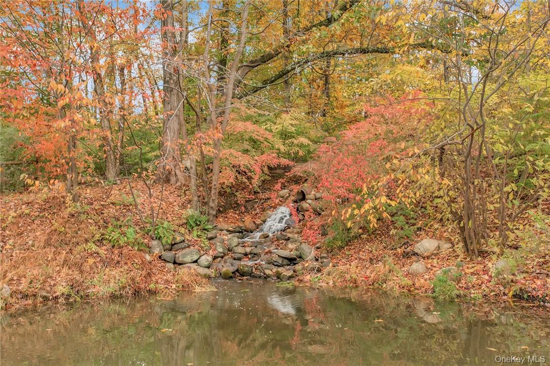 237 Tomahawk Street, Unit 3 Baldwin Place, NY 10505 - Photo 21 of 22 a view of a yard with a tree