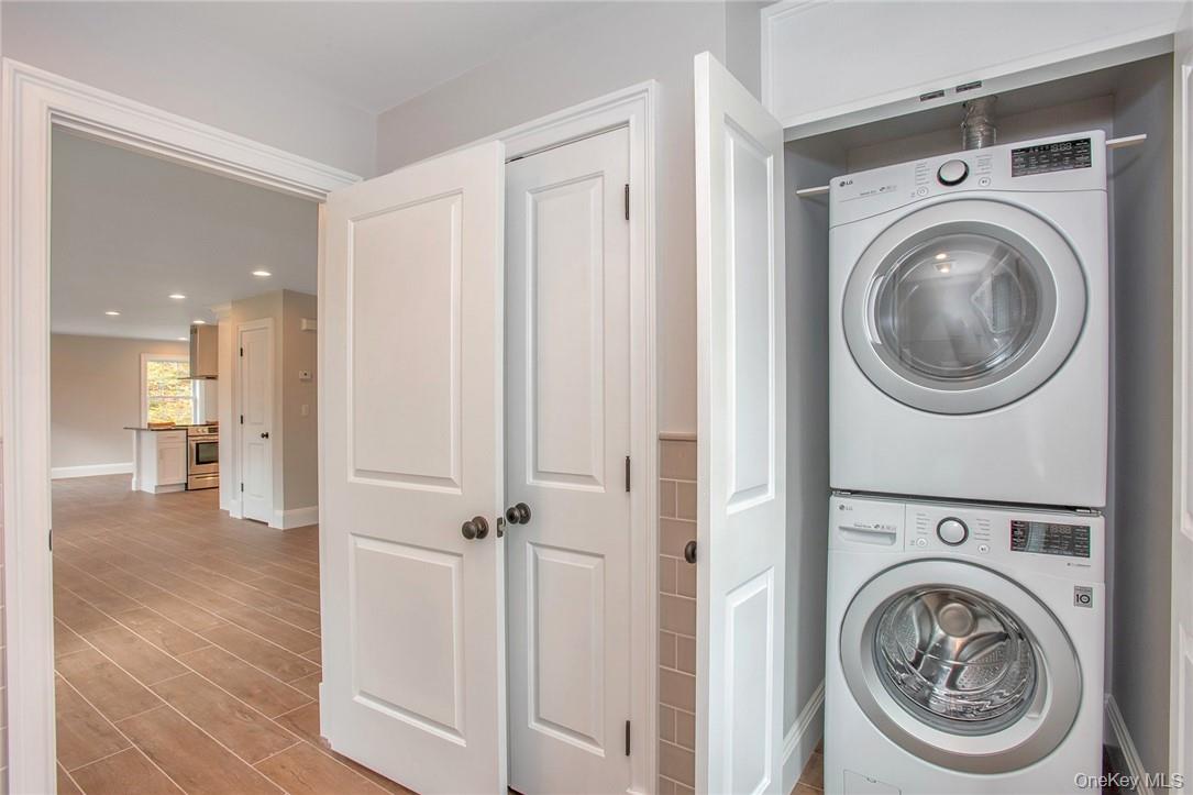 237 Tomahawk Street, Unit 3 Baldwin Place, NY 10505 - Photo 7 of 22 a view of a hallway with washer and dryer