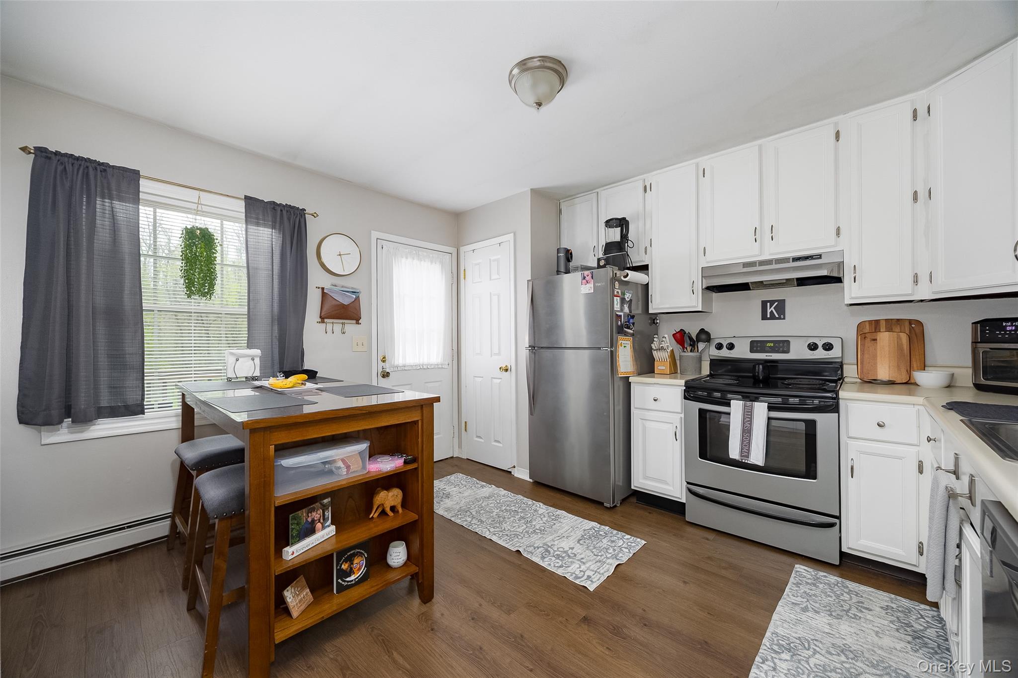 178 Overlook Road Poughkeepsie, NY 12603 - Photo 12 of 30 a kitchen with stainless steel appliances a stove a refrigerator and a cabinets