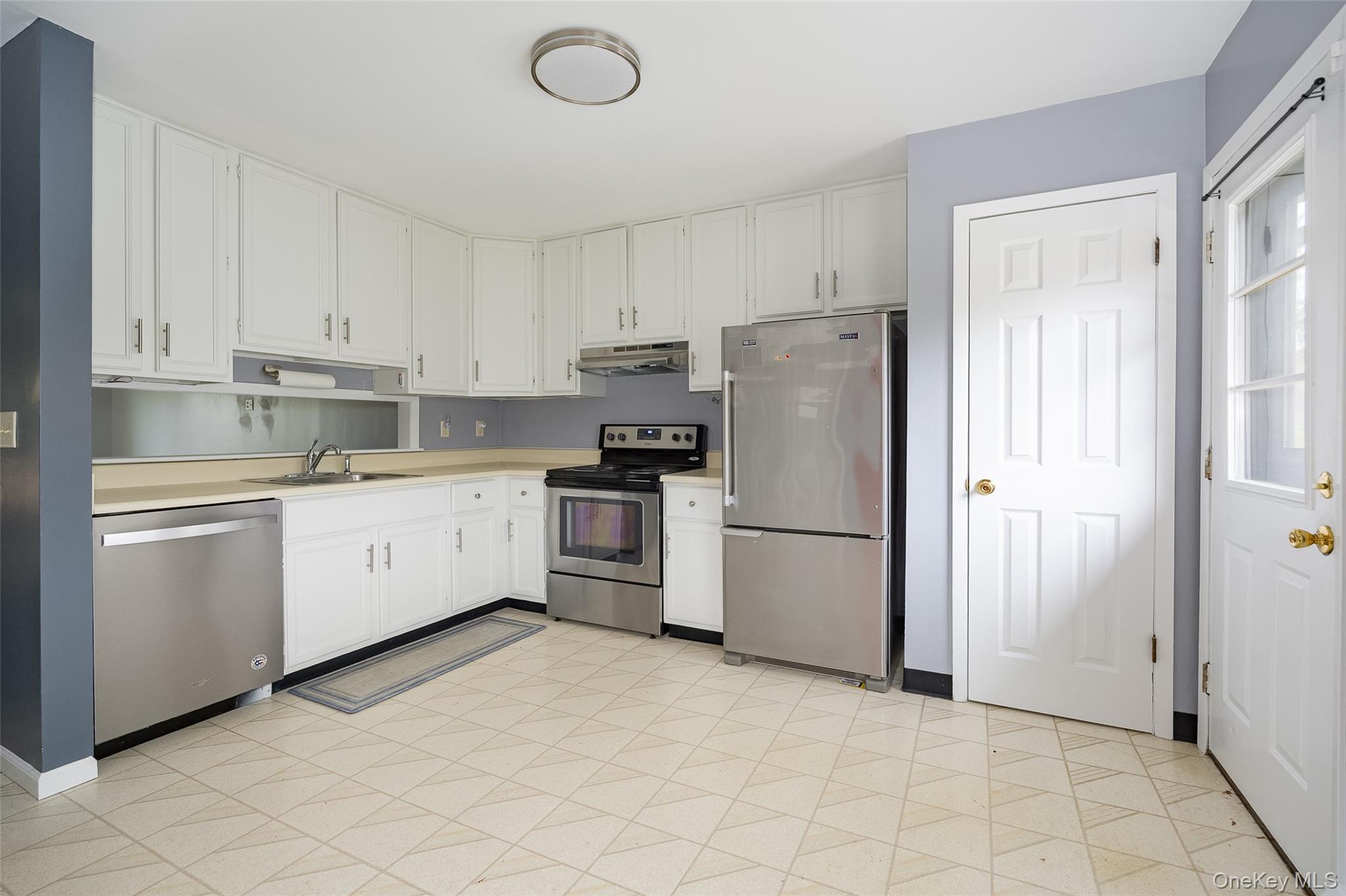 178 Overlook Road Poughkeepsie, NY 12603 - Photo 14 of 30 a kitchen with a refrigerator sink stove and cabinets