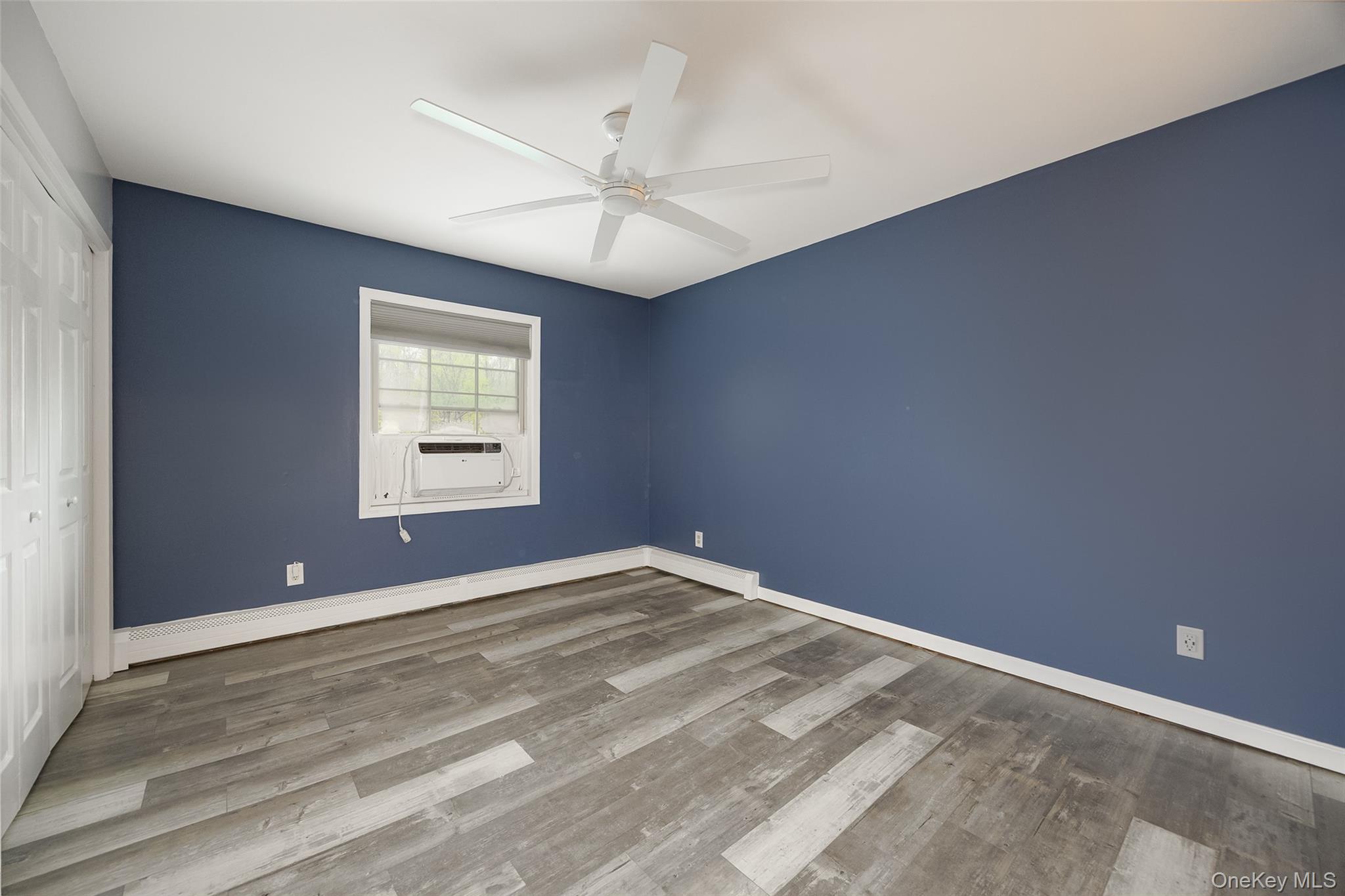 178 Overlook Road Poughkeepsie, NY 12603 - Photo 24 of 30 an empty room with a window and a fan