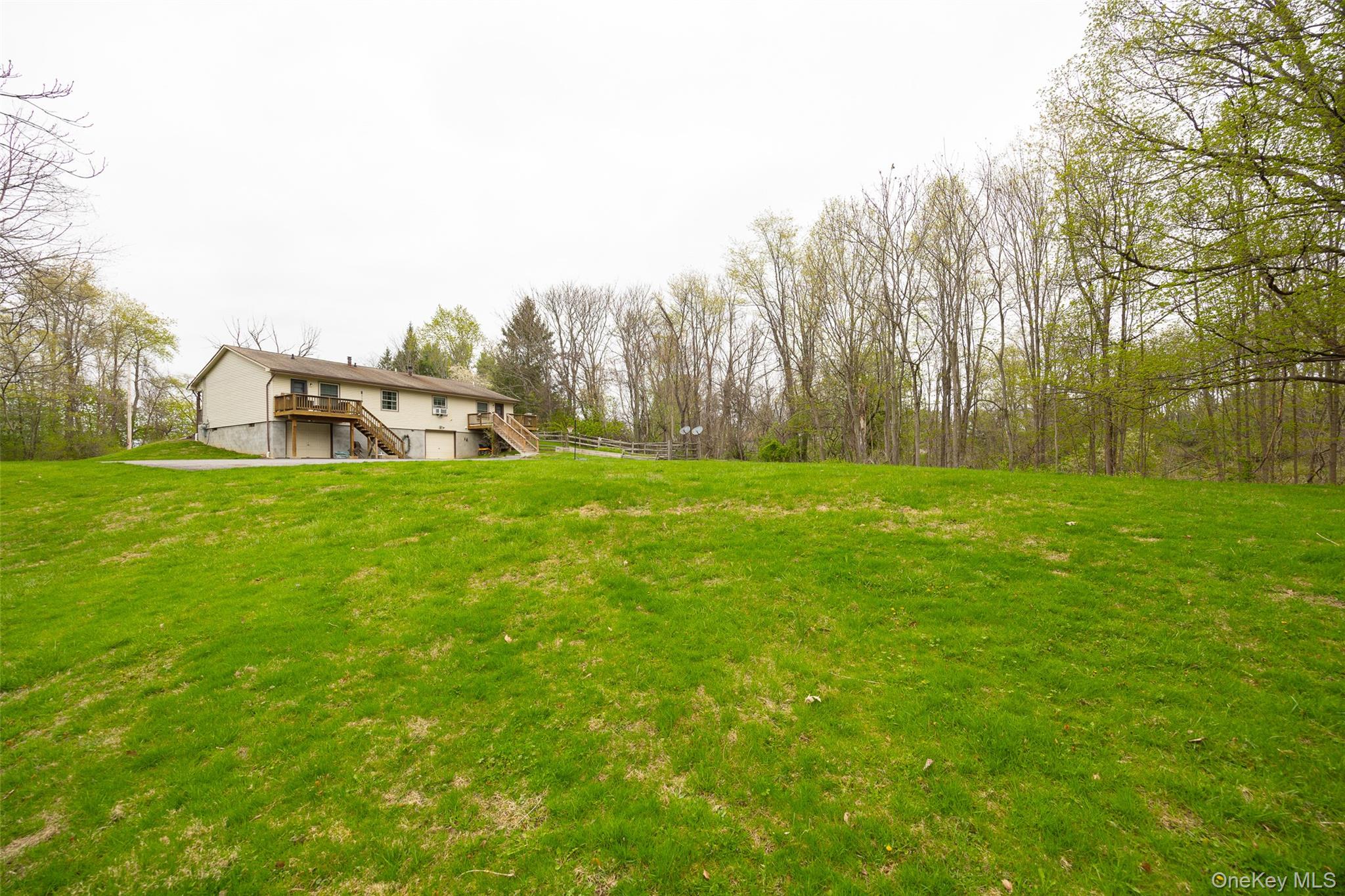 178 Overlook Road Poughkeepsie, NY 12603 - Photo 7 of 30 a backyard of a house with lots of green space and trampoline