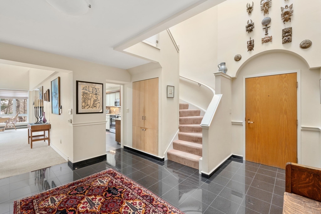 241 Perkins Street, Unit C402 Boston, MA 02130 - Photo 11 of 33 a view of a livingroom with furniture and staircase