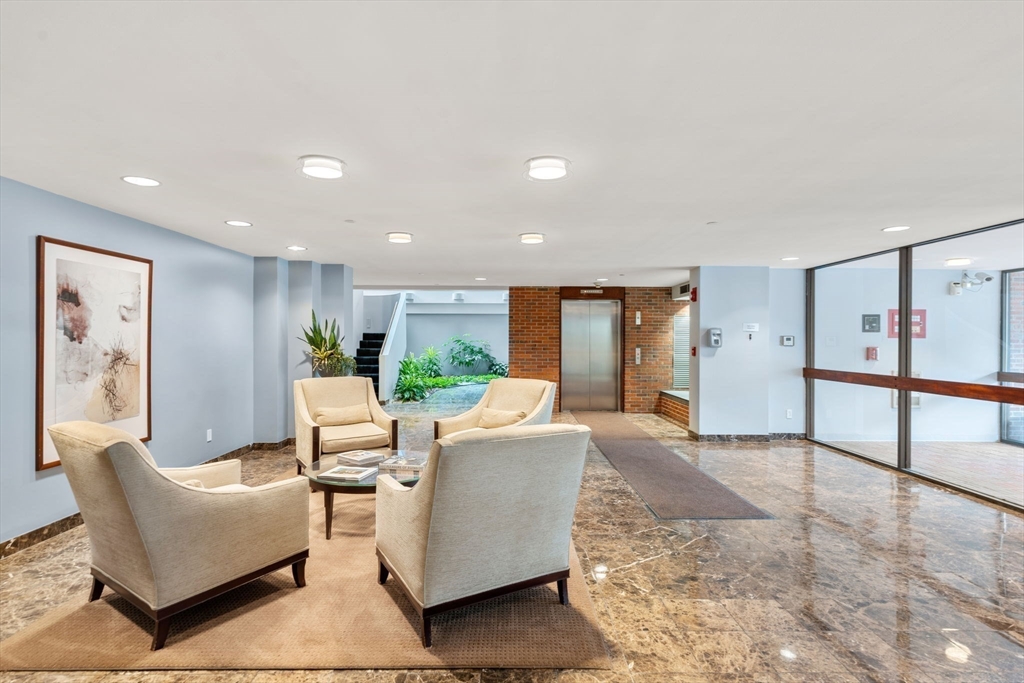 241 Perkins Street, Unit C402 Boston, MA 02130 - Photo 28 of 33 a living room with furniture and a window