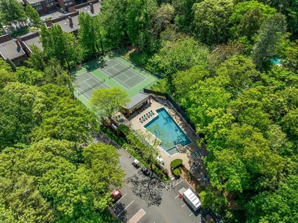 an aerial view of a house with a yard