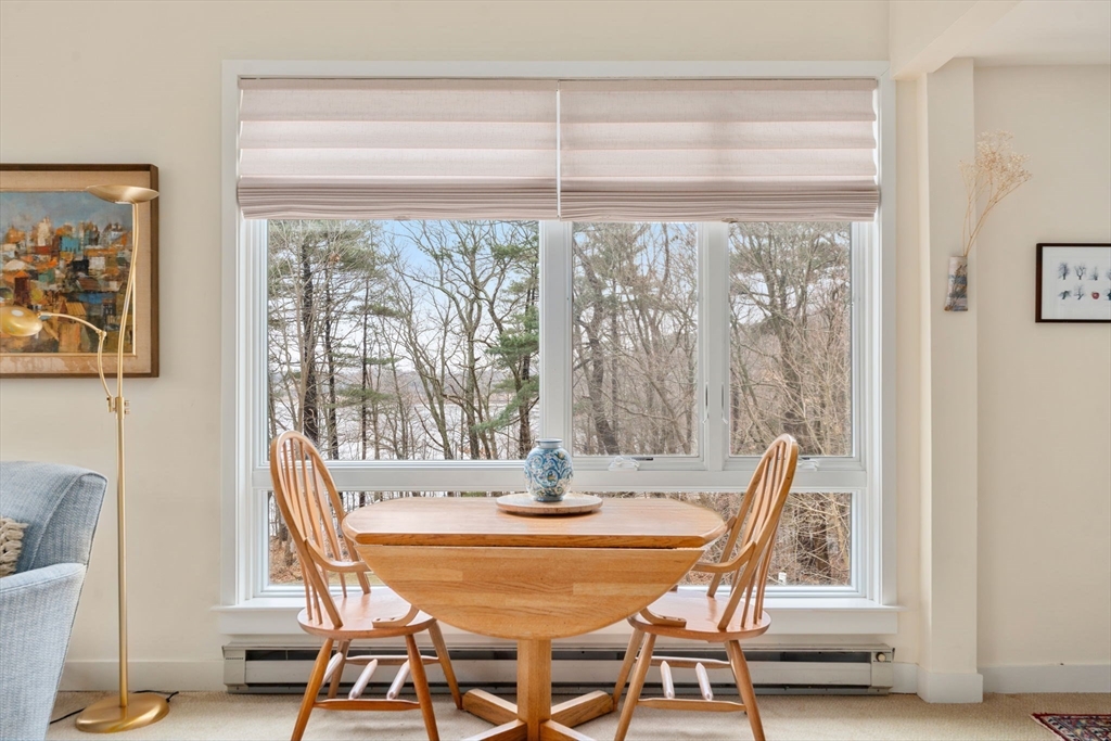 241 Perkins Street, Unit C402 Boston, MA 02130 - Photo 5 of 33 a dining room with furniture and window