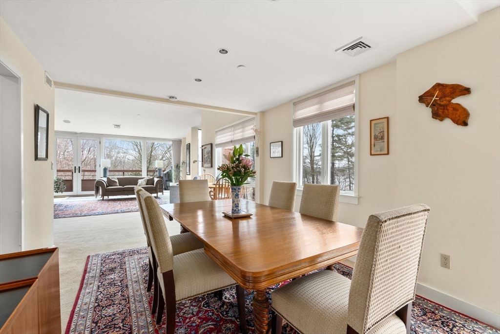 241 Perkins Street, Unit C402 Boston, MA 02130 - Photo 7 of 33 a dining room with furniture and wooden floor