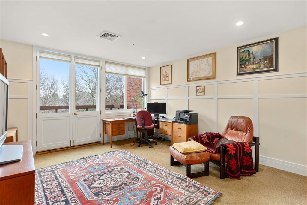 241 Perkins Street, Unit C402 Boston, MA 02130 - Photo 9 of 33 a living room with furniture and a window