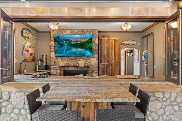 a view of living room kitchen with stainless steel appliances granite countertop living room