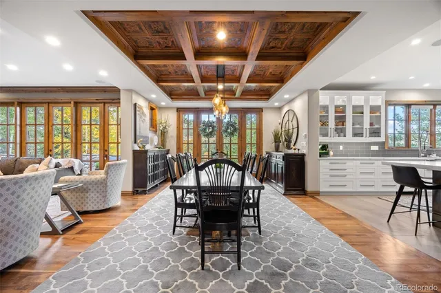a very nice looking living room with a dining table and chairs