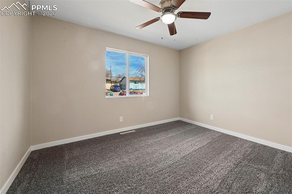 1901 Whitman Road Colorado Springs, CO 80910 - Photo 12 of 35 an empty room with a window