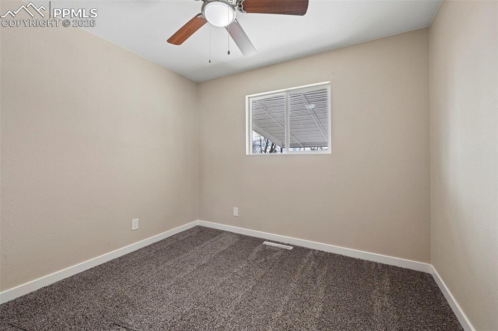 1901 Whitman Road Colorado Springs, CO 80910 - Photo 16 of 35 an empty room with a window