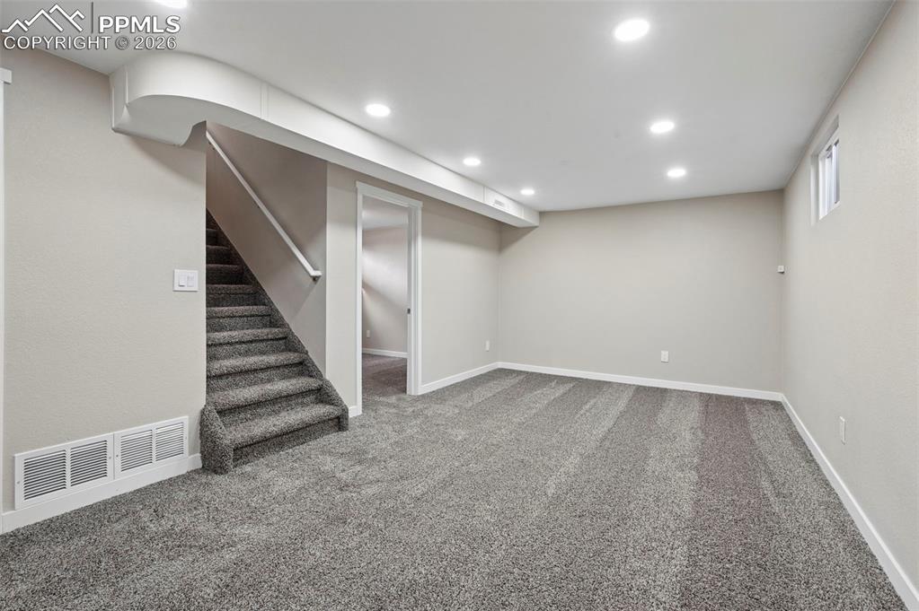 1901 Whitman Road Colorado Springs, CO 80910 - Photo 18 of 35 a view of an empty room with stairs
