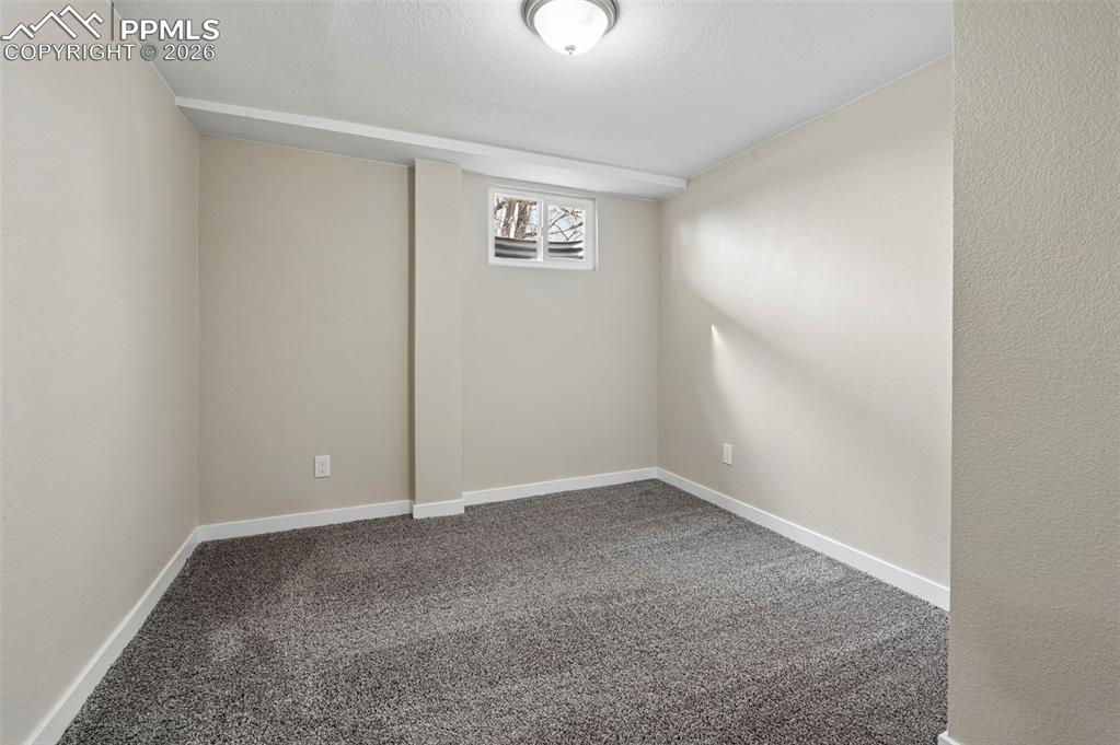 1901 Whitman Road Colorado Springs, CO 80910 - Photo 20 of 35 an empty room with windows