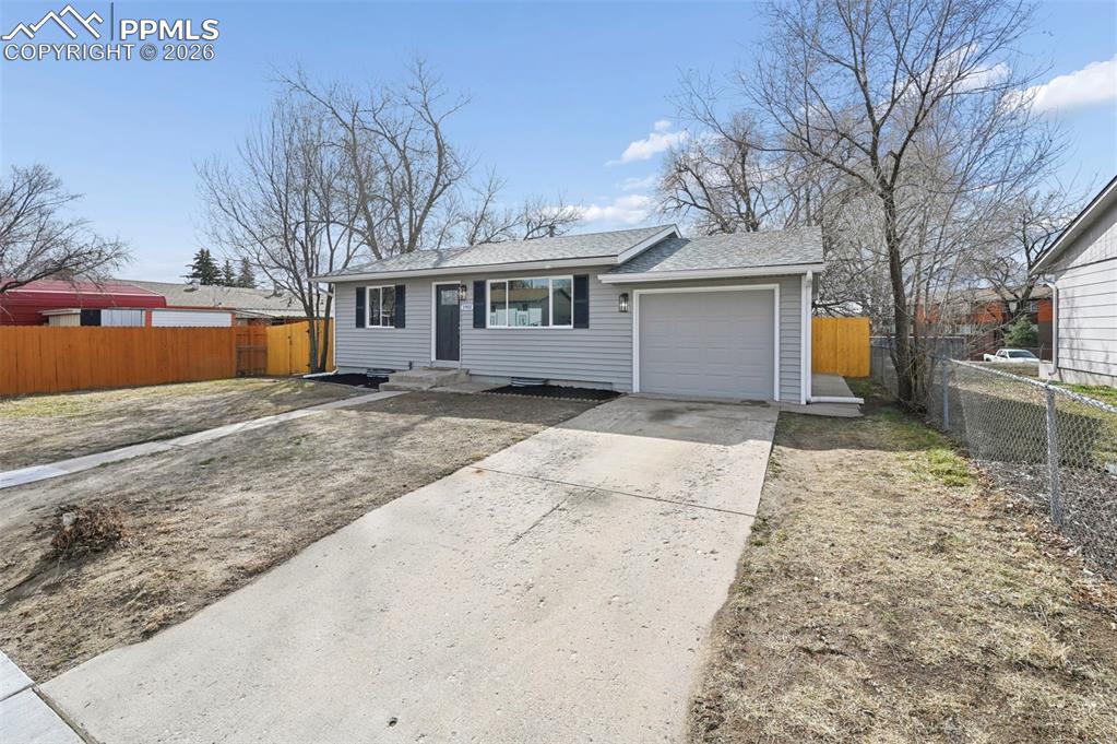 1901 Whitman Road Colorado Springs, CO 80910 - Photo 2 of 35 a view of a house with a yard covered in snow