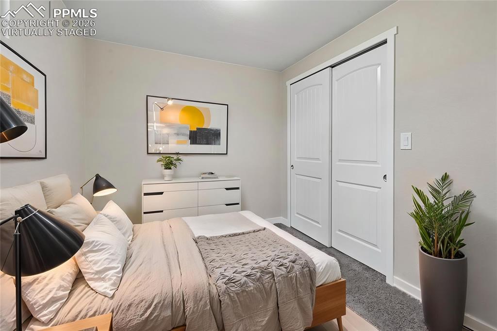 1901 Whitman Road Colorado Springs, CO 80910 - Photo 30 of 35 a bedroom with a bed and utility room