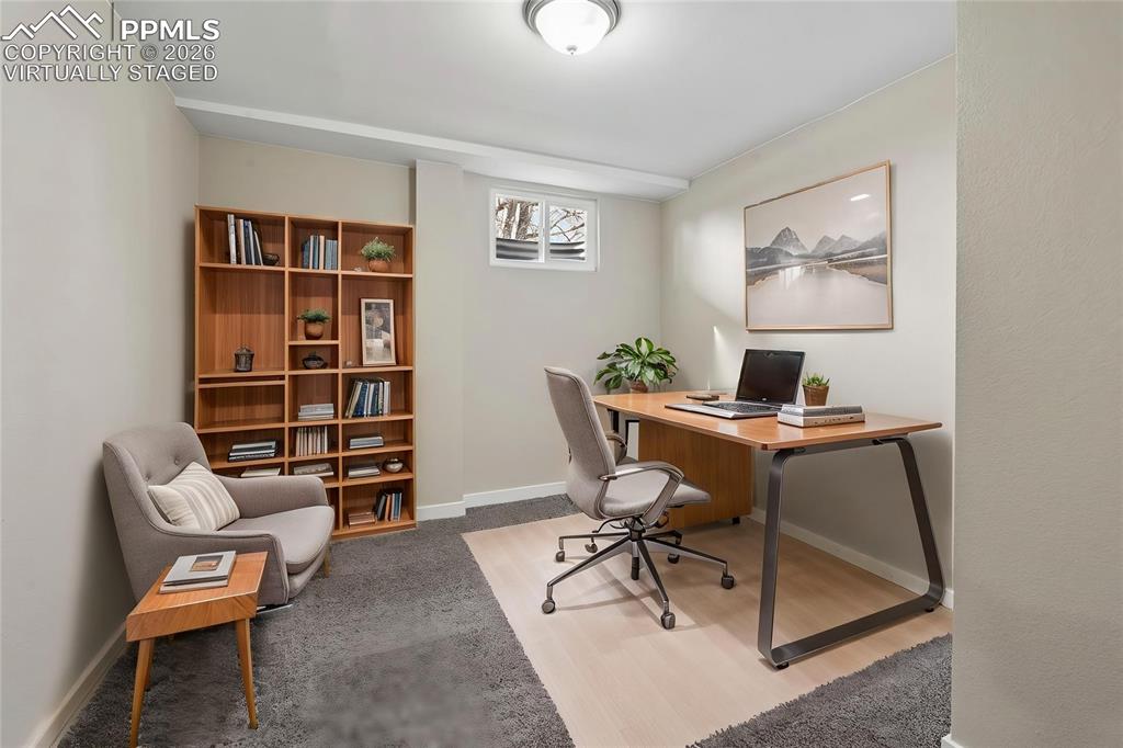 1901 Whitman Road Colorado Springs, CO 80910 - Photo 31 of 35 a view of a workspace with furniture and a workspace