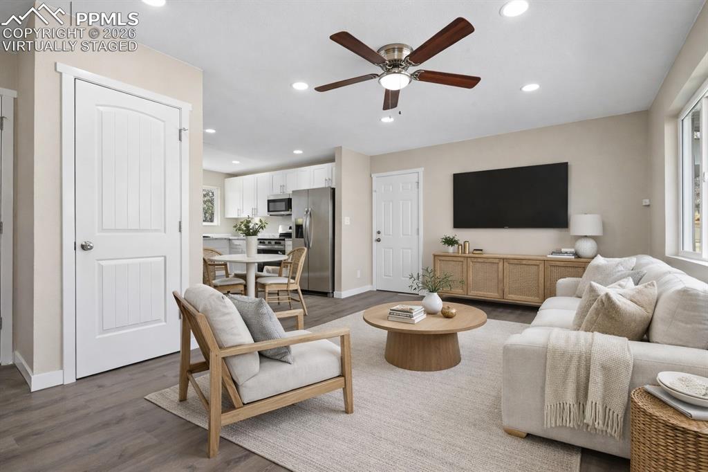 1901 Whitman Road Colorado Springs, CO 80910 - Photo 32 of 35 a living room with furniture and a flat screen tv