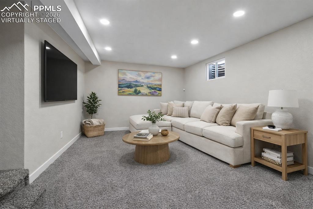 1901 Whitman Road Colorado Springs, CO 80910 - Photo 35 of 35 a living room with furniture and a flat screen tv