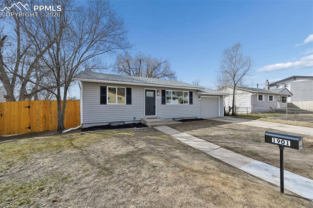 1901 Whitman Road Colorado Springs, CO 80910 - Photo 5 of 35 a view of a house with snow on the road