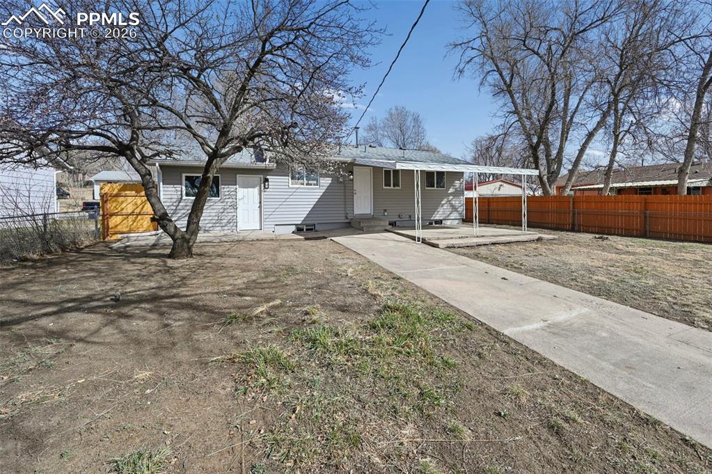 1901 Whitman Road Colorado Springs, CO 80910 - Photo 6 of 35 a view of a house with snow on the road
