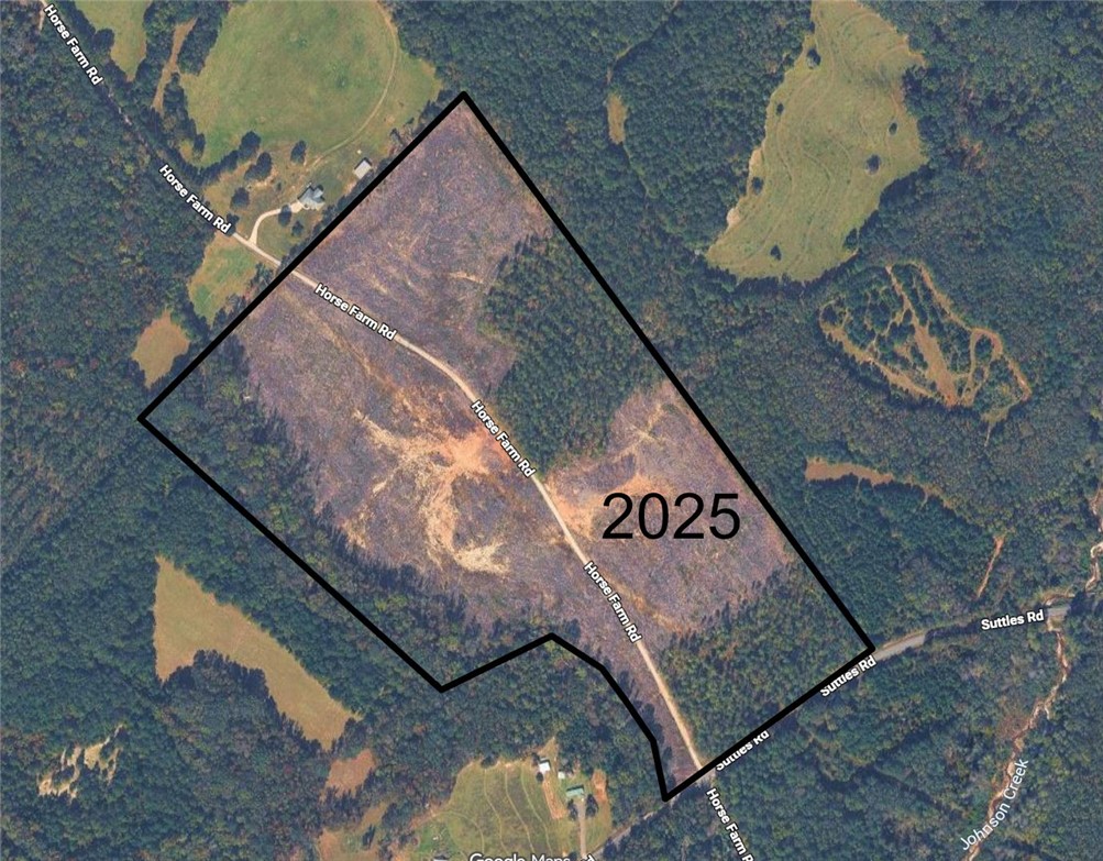 An aerial outline showcases the expansive boundaries of this forested acreage.