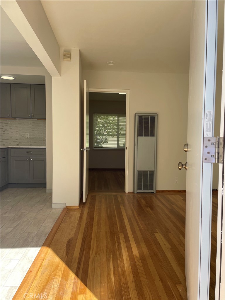 4806 Clarke Street, Unit 2 Oakland, CA 94609 - Photo 2 of 13 a view of a room with wooden floor and a bathroom
