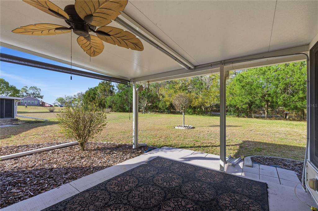 10689 Southeast 174th Loop Summerfield, FL 34491 - Photo 12 of 45 a view of a street with a big yard
