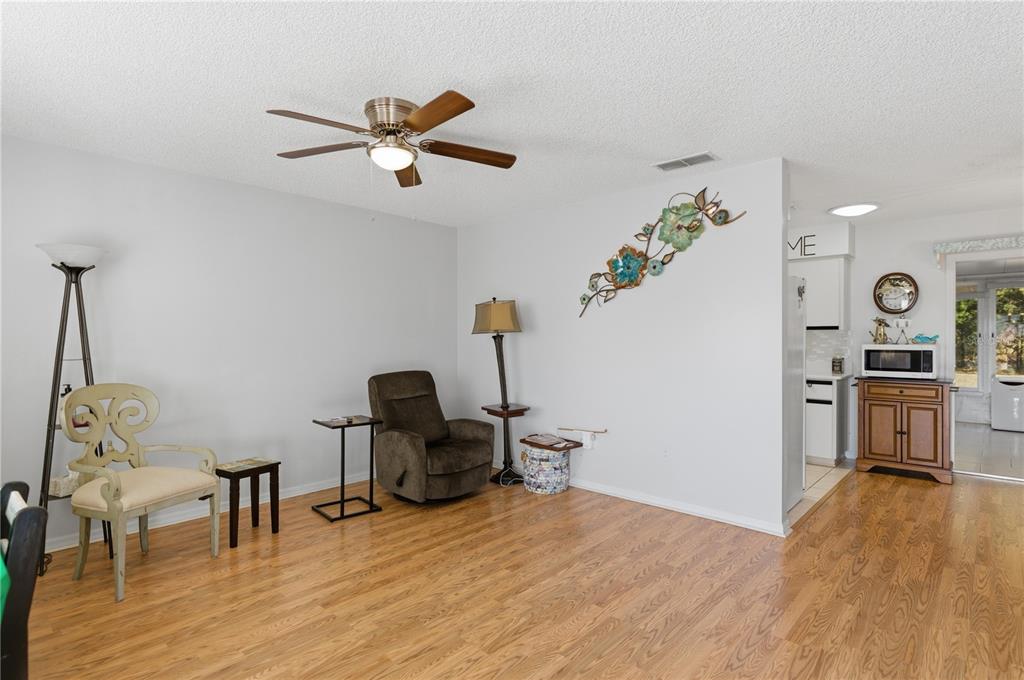 10689 Southeast 174th Loop Summerfield, FL 34491 - Photo 16 of 45 a view of a workspace with furniture and wooden floor