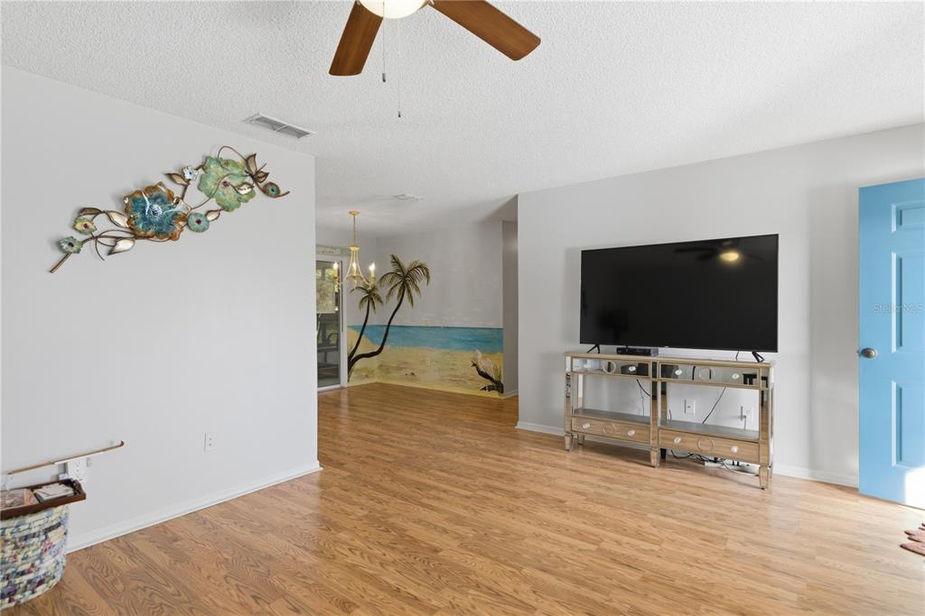 10689 Southeast 174th Loop Summerfield, FL 34491 - Photo 17 of 45 a living room with furniture and a flat screen tv