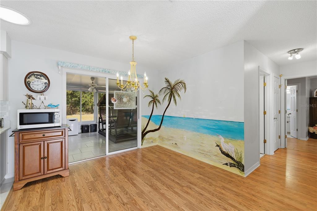 10689 Southeast 174th Loop Summerfield, FL 34491 - Photo 18 of 45 a view of a room with wooden floor and window
