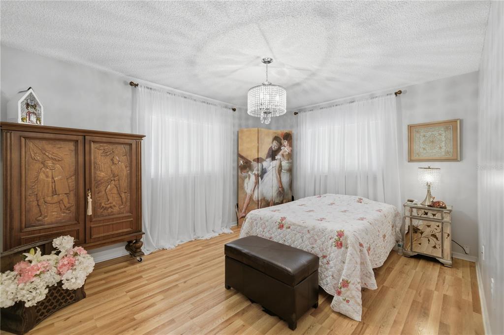 10689 Southeast 174th Loop Summerfield, FL 34491 - Photo 27 of 45 a bedroom with a bed and a dresser