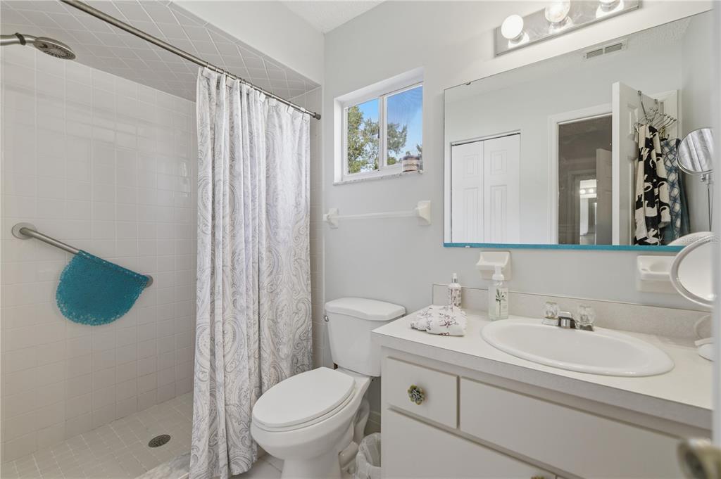 10689 Southeast 174th Loop Summerfield, FL 34491 - Photo 29 of 45 a bathroom with a sink toilet and shower