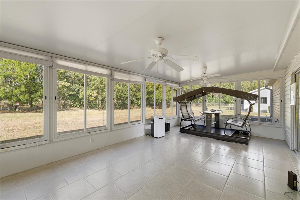 10689 Southeast 174th Loop Summerfield, FL 34491 - Photo 30 of 45 a living room with furniture and a large window