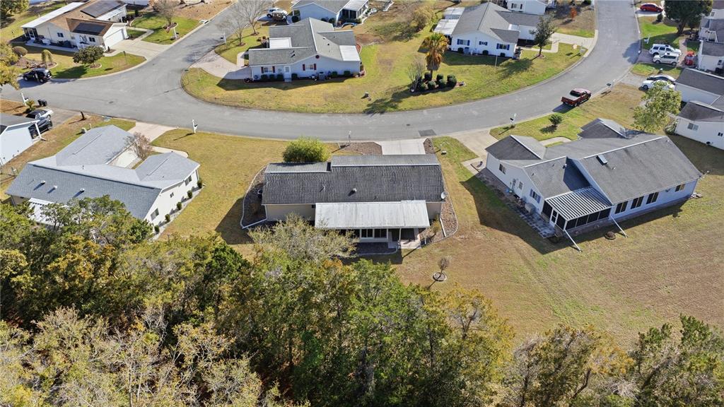 10689 Southeast 174th Loop Summerfield, FL 34491 - Photo 34 of 45 an aerial view of a house with a swimming pool