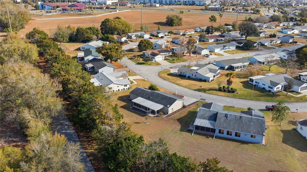 10689 Southeast 174th Loop Summerfield, FL 34491 - Photo 35 of 45 an aerial view of a house with a lake view