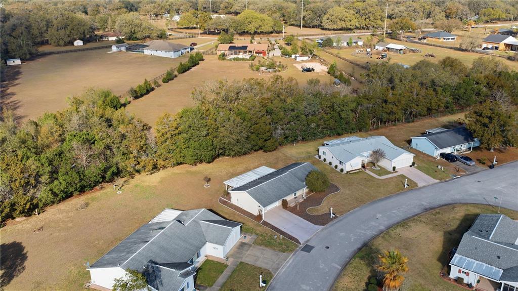 10689 Southeast 174th Loop Summerfield, FL 34491 - Photo 36 of 45 an aerial view of residential houses with outdoor space