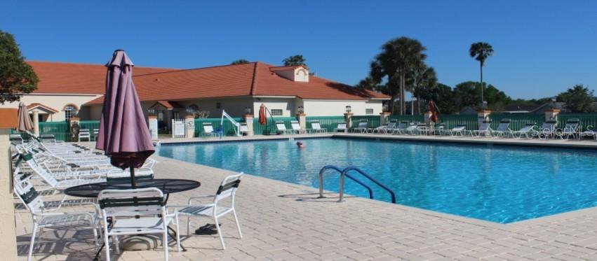 10689 Southeast 174th Loop Summerfield, FL 34491 - Photo 41 of 45 a view of a lake with a table and chairs