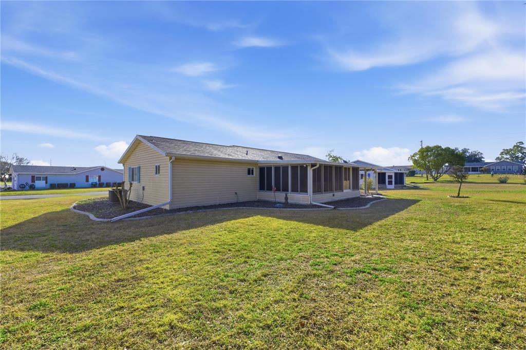 10689 Southeast 174th Loop Summerfield, FL 34491 - Photo 5 of 45 a view of an house with backyard space and balcony