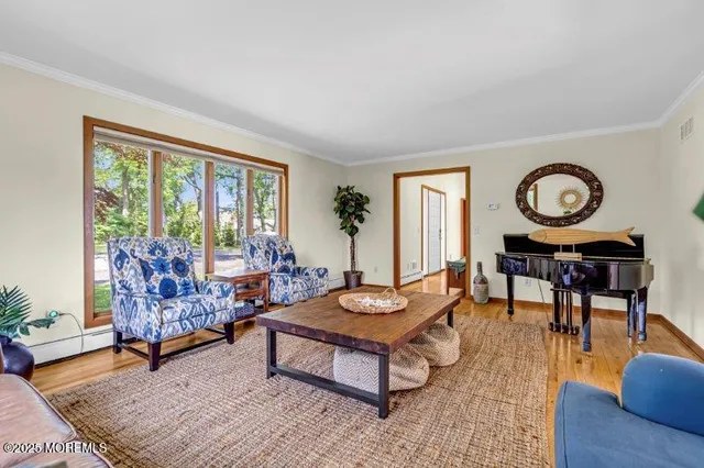 a view of a livingroom with furniture and wooden floor