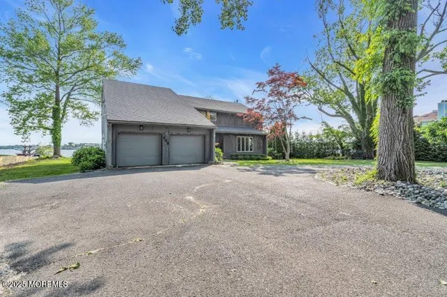 a view of staircase with wooden floor and a window