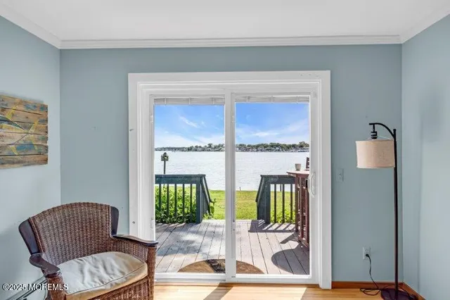 a view of staircase with wooden floor and a window