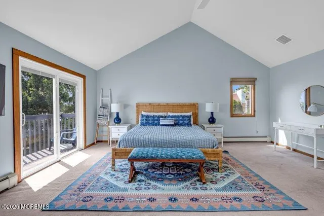 a view of a balcony with chairs and wooden floor