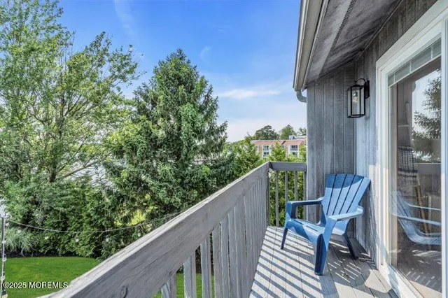 a view of a patio with couches chairs and a potted plant