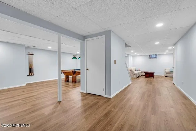 a view of a patio with chairs next to a yard