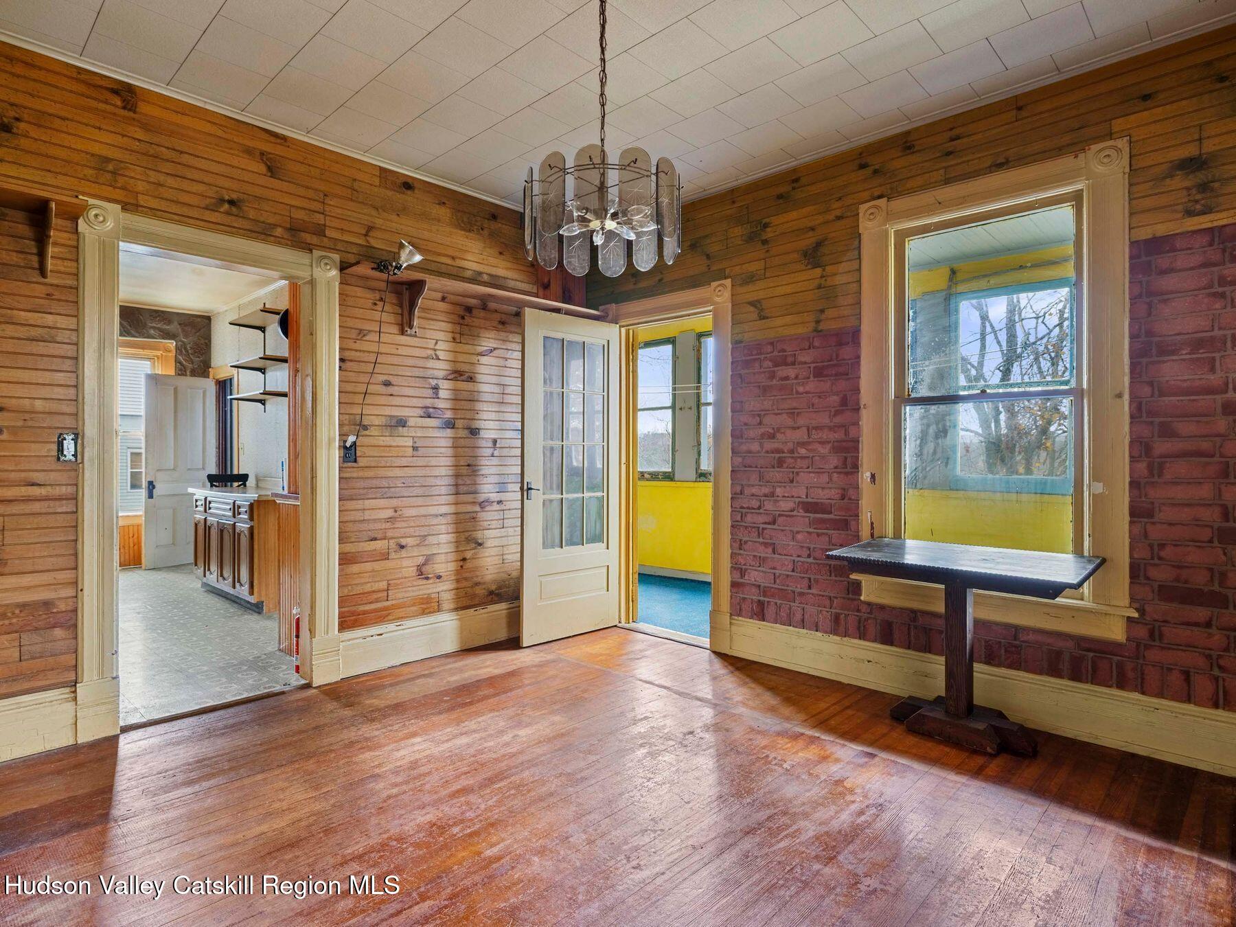 29 New Street Catskill, NY 12414 - Photo 14 of 46 a view of a livingroom with furniture window and wooden floor